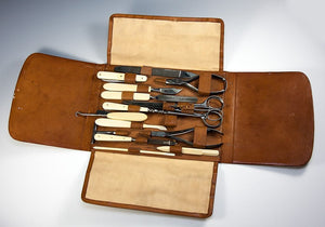 Antique French Ostrich Leather Folding Vanity Case with 15 Implements, One Marked Louis Vuitton