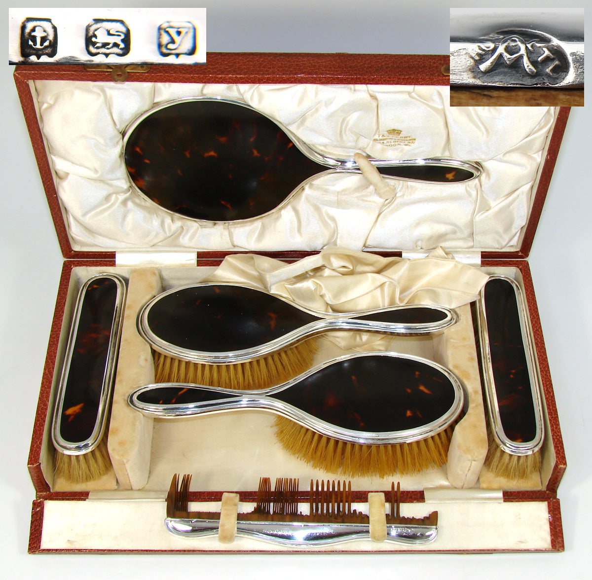 silver and tortoiseshell dressing table set George V silver and tortoiseshell dressing table set consisting of mirror, two handled brushes, two